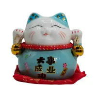 Hucha de cerámica en forma de gato - Azul sobre cojín